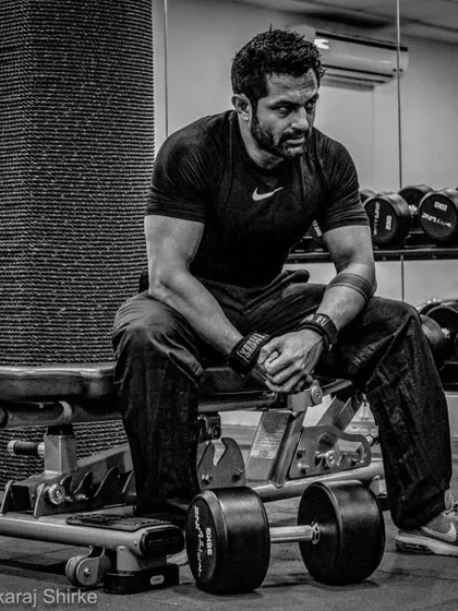 A moment of rest between sets. Strength training is a grind, but it's the foundation of a powerful fighter.