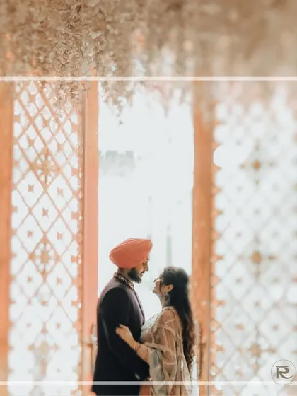 An artistic silhouette of the couple framed by an ornate doorway. This shot uses light and shadow to create a dreamy and romantic engagement portrait.