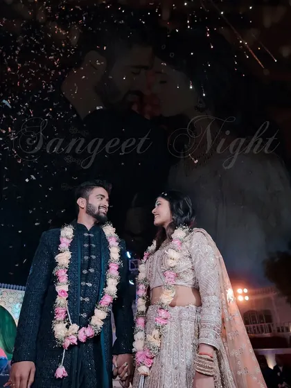 A beautiful shot of the couple on their Sangeet stage, with a creative overlay of their close-up portrait. This artistic edit adds a layer of romance and storytelling to the image.