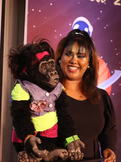 Posing with Nikki on stage. We are a complete entertainment package, ready to bring fun and laughter to your next event.