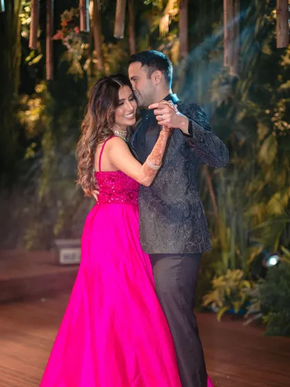 An intimate moment captured during a reception dance, showcasing the couple's close connection and happiness.