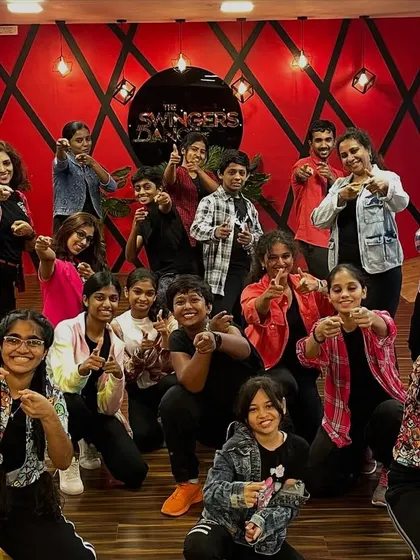 Our teens and adults group ready to take on a new choreography. The camaraderie and shared passion in this class are what make it so special.