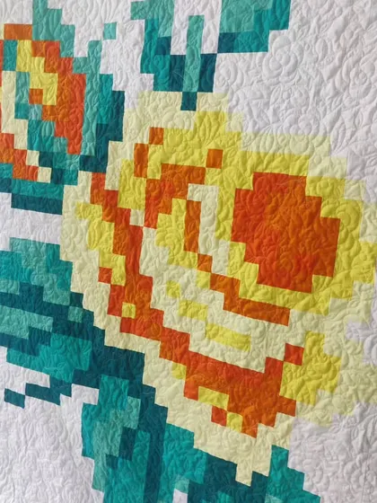 A close-up of the yellow pixelated rose, showing how the small squares blend to create a larger image.