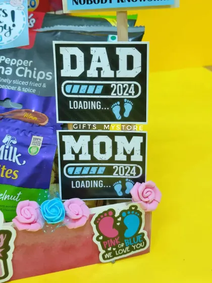 "Dad loading... Mom loading..." Fun tags for the parents-to-be, included in the baby shower hamper.