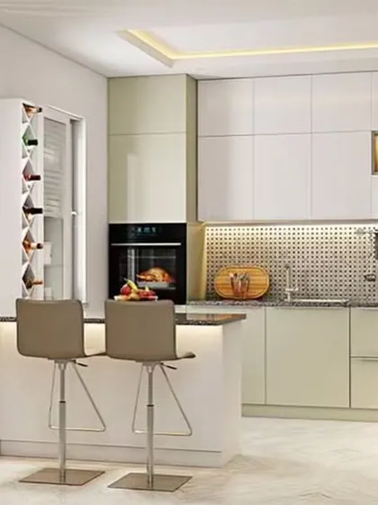 A peninsula with seating separates the kitchen from the living area in this open-plan design. A decorative partition adds a layer of privacy and style.