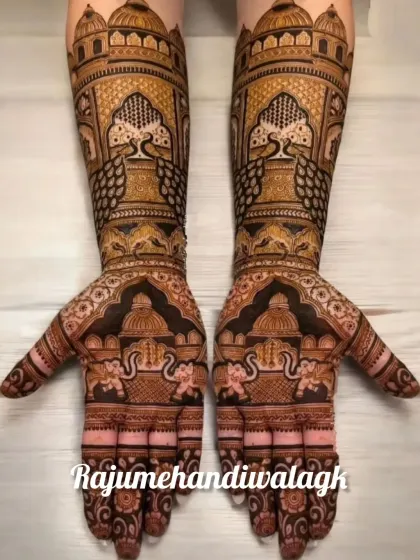 A very grand and symmetrical design, this mehendi features palace architecture, peacocks, and elephants, creating a look of pure royalty.
