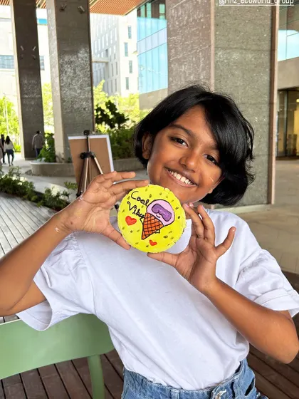 A happy young artist with her "Cool Vibes" ice cream-themed painting. Our art station at RMZ Ecoworld was a huge hit, with kids creating all sorts of colorful pieces.
