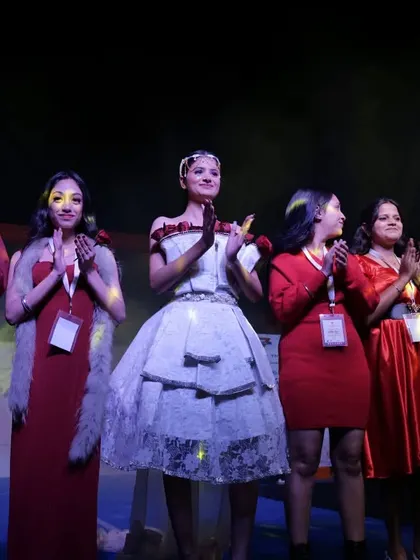 Student designers and models take a final bow, celebrating the success of their collection.