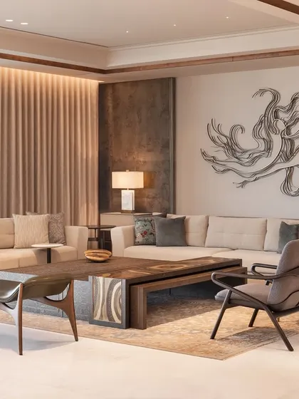 Another angle of this contemporary living space, showing the relationship between the seating arrangement and the large-scale wall art. The custom armchairs and sleek bench are positioned to create a comfortable and engaging environment for both relaxation and appreciating art.