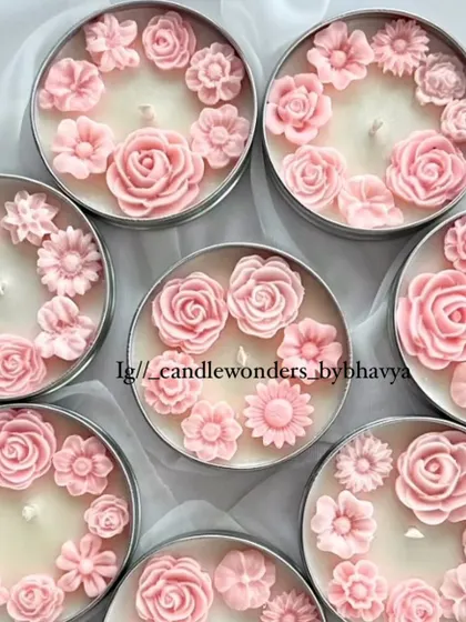 My enchanted rose tin jar candle is one of my most beloved designs. The tin is filled with small wax flowers, creating a beautiful floral landscape.