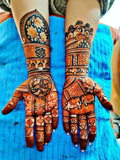 A stunning festive design with elephants and birds. The deep orange stain is the first stage of my organic henna, which darkens over 48 hours.