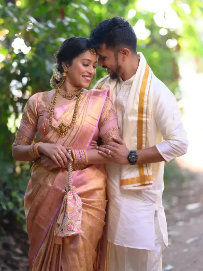 A quiet, intimate moment from a pre-wedding shoot. My goal is to capture these unscripted connections, using natural light to highlight the couple's bond in their beautiful traditional attire.
