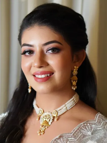 This is the 'lit-from-within' glow I strive for with every client. Prer is shining bright with a radiant complexion, subtly defined eyes, and a warm smile for her special event.