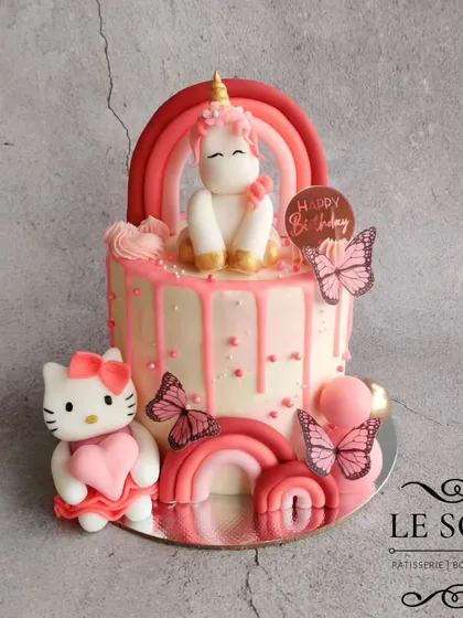 This cake is a dream for any fan of pink, unicorns, and Hello Kitty. This 1 kg Vanilla Butterscotch cake combines all three themes with a pink drip, fondant figurines, and rainbows.