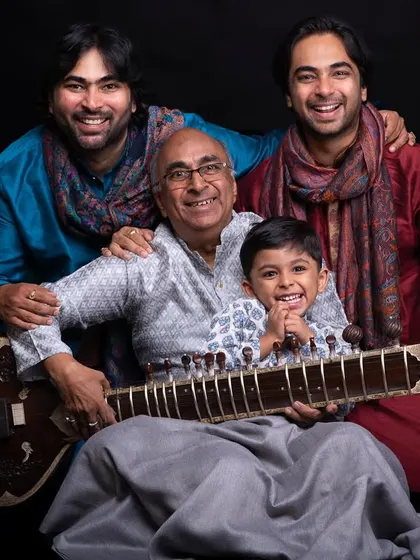 A family portrait on Gurupoornima with my Baba (father and guru), my brother, and my nephew. My musical lineage and family are the foundation of everything I do.