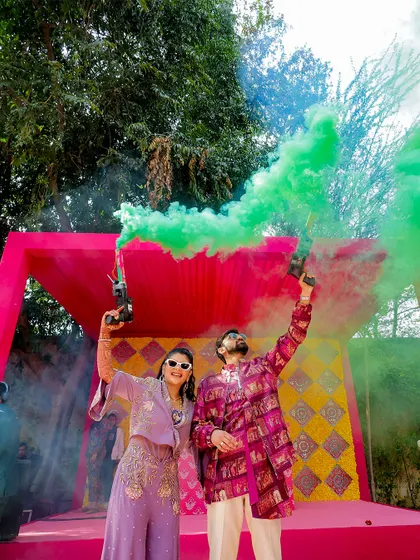 The couple makes a colorful entry with smoke bombs, adding a modern and fun twist to their celebration. These moments make for incredible, high-energy photos.