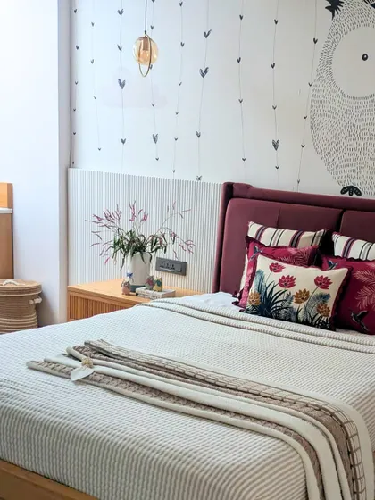 A glimpse into our Baan Sukh project, where art and greenery are woven into every corner. This bedroom detail shows a custom fluted wall panel and a bed dressed in rich textiles, reflecting a home that is alive with nature and tradition.