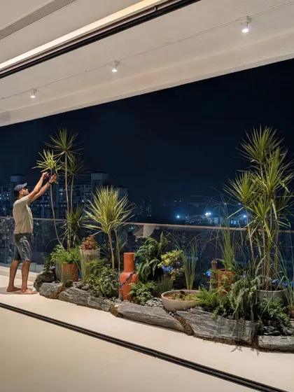 Our co-founder, Angud, giving the finishing touches to an ambitious rock garden on a client's deck. This shows our hands-on approach to making every detail perfect.