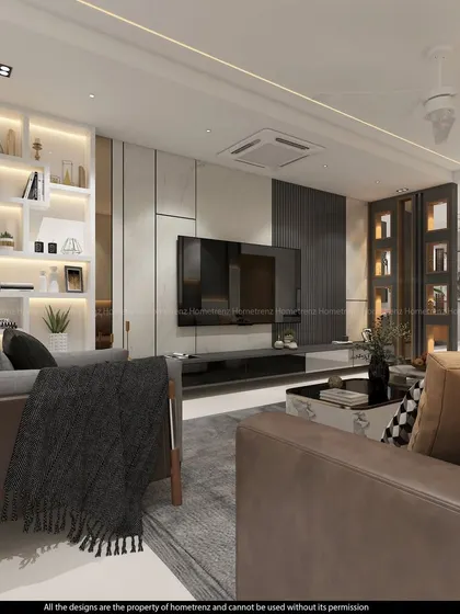 This living room design features a large, comfortable sofa and a TV unit set against a wall of mixed textures, including marble-finish panels and dark fluted sections. The built-in, back-lit shelving adds a touch of sophistication.