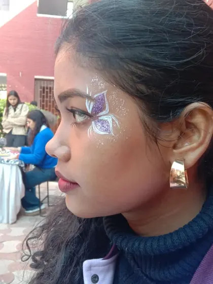A purple and white butterfly with intricate line work. This is a great example of a more stylized, artistic design.