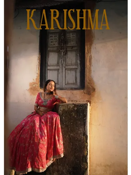 A striking portrait of the bride at her Mehandi, posing against an old, rustic window. The image has a timeless, almost painterly quality.