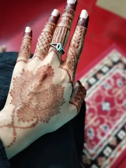 A delicate mandala design with a beautiful mature stain. This is a perfect example of a simple yet elegant henna look.