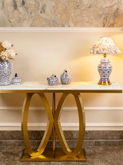 Here you can see my blue pottery lamps styled on a modern gold and marble console table. The contrast between the classic ceramic and the contemporary furniture creates a sophisticated, eclectic look.