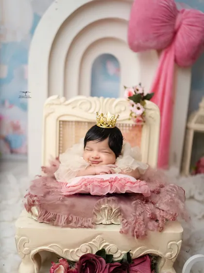 A tiny princess dreaming sweet dreams. This image captures the pure innocence I aim for in my posed newborn sessions, complete with a delicate crown and the softest smile.
