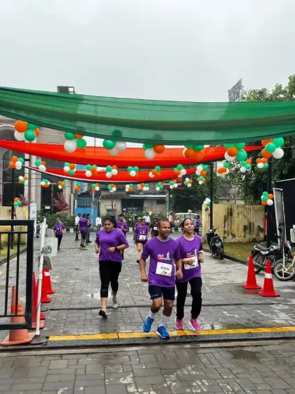 Runners at the DLF Freedom Run make their way through a course decorated in the national colors. I ensure every event has a professional and festive atmosphere, from the track setup to the branding.