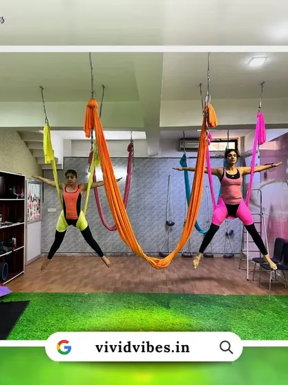 Learn to spread your wings and fly high with your tribe. This image shows two students practicing in sync, demonstrating the connection we build.