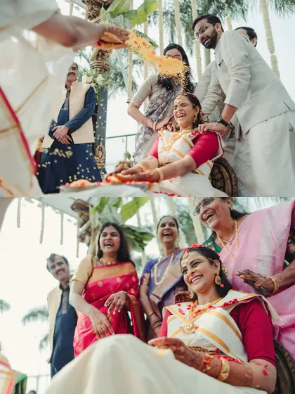 The bride's family showering her with turmeric-coated rice, a beautiful and significant ritual in many South Indian weddings.