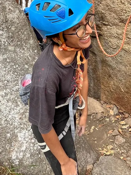 Nikitha all smiles at the crag. Her journey from a BCI workshop participant to a confident lead climber is what our community is all about.