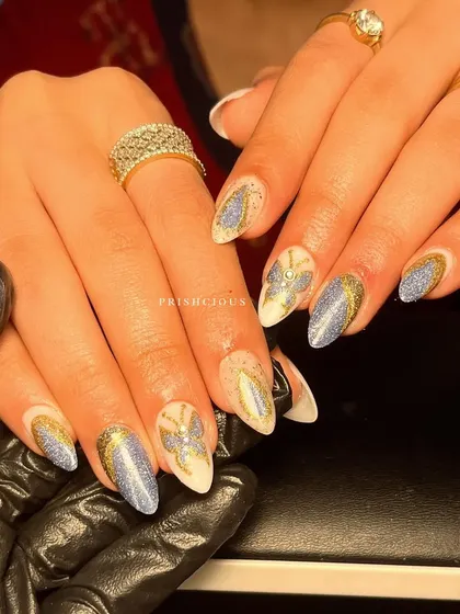 Glitz and glam with this butterfly-themed set. I used a combination of blue cat eye glitter and gold glitter to create this sparkling design.