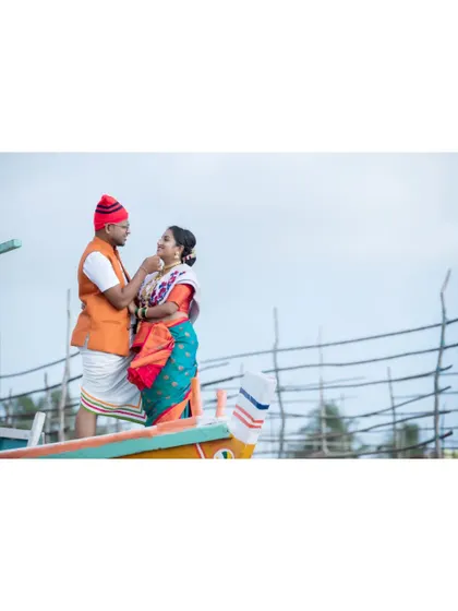An intimate moment from the Koli-themed pre-wedding shoot, set against the backdrop of the fishing village.