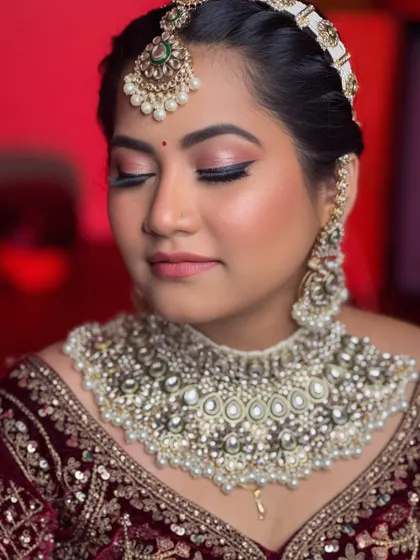 The epitome of bridal elegance. A close-up on the soft, shimmery eye makeup and flawless skin of this beautiful bride.