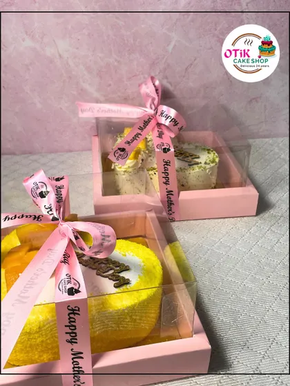 My Mother's Day gift boxes, featuring mini cakes and other treats, all wrapped with a special "Happy Mother's Day" ribbon.