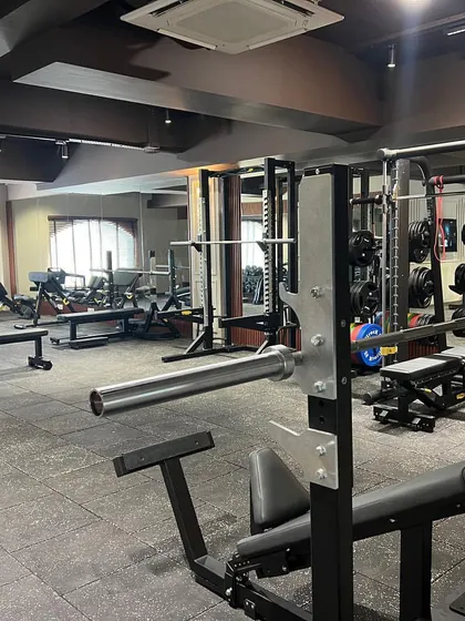 A wide view of our extensive weight training floor, packed with a variety of machines and free weights to build your ideal physique.