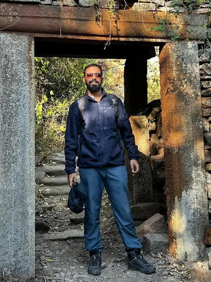 A duplicate of my pose at the stone doorway during an outdoor adventure.