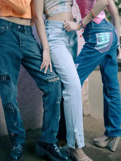 A detail shot from the '501: Safety Check' project, selected for the Levi's x PhotoVogue global open call. It shows the customized details on three different pairs of Levi's 501 jeans, celebrating personal style and heritage.