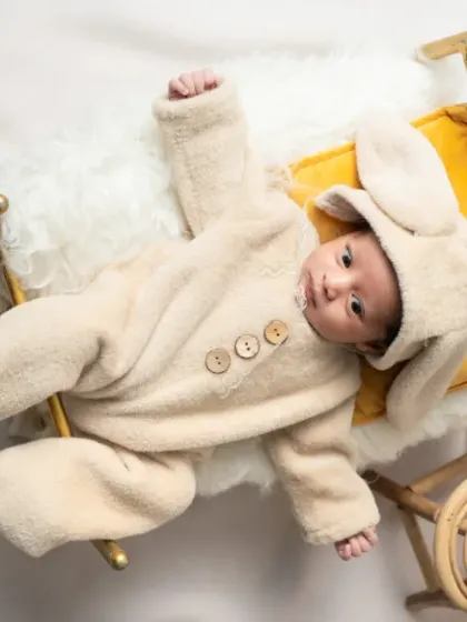 Snuggled up and dreaming. I have a collection of soft, adorable animal outfits, like this fluffy bunny costume, that are perfect for a cozy and cute newborn photo.