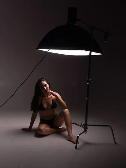 Another shot showing the single-light setup. The model is positioned to catch the soft light from the large beauty dish.