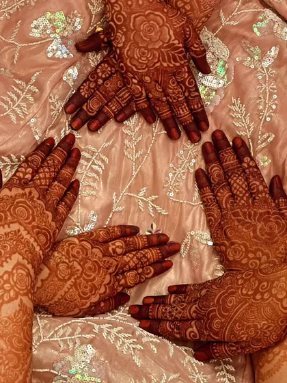 More happy clients showing off their matching henna stains. Perfect for a bridal party.