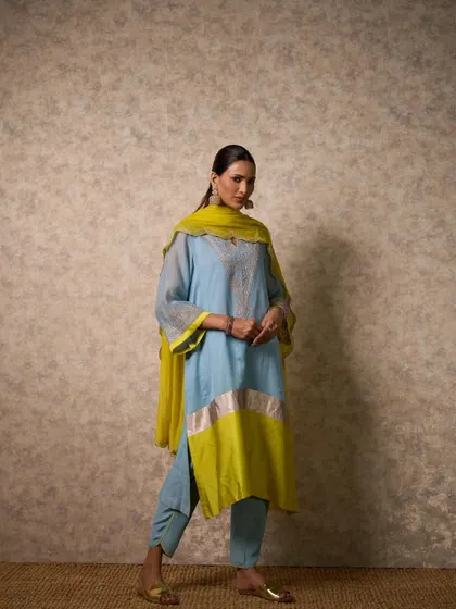A beautiful sky blue and lime yellow kurta set. This is another example of a refreshing color combination that is perfect for daytime celebrations like a Mehendi or Haldi.