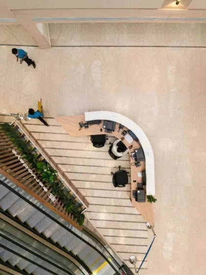 An alternate top-down view of the Sarvodaya Hospital reception area, showcasing the transformation of a commercial space into a bustling healthcare hub. Adaptive reuse allows for creative and efficient space planning.