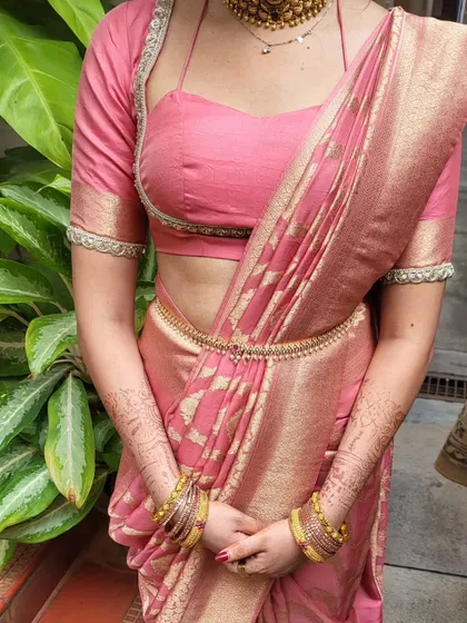 A close-up of the body-hug drape, showing the neat pleats and how the fabric is contoured to the body. This style is secured to stay in place all day.