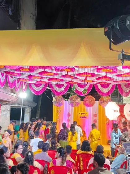 Another angle of the outdoor Haldi event, showing the crowd and the lighting setup. I ensure the lighting is perfect for both the ceremony and the party that follows.