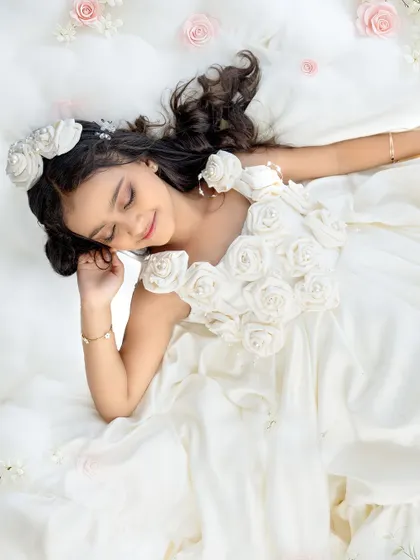 A peaceful, sleeping beauty pose. This artistic shot adds a touch of magic and serenity to her seventh birthday gallery.