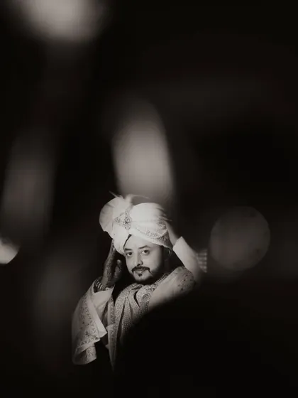 The groom's anticipation is a powerful part of the story. This artistic, black and white portrait of Ananta at Hotel Silver Spoon captures the quiet moments of reflection before he begins his new chapter.