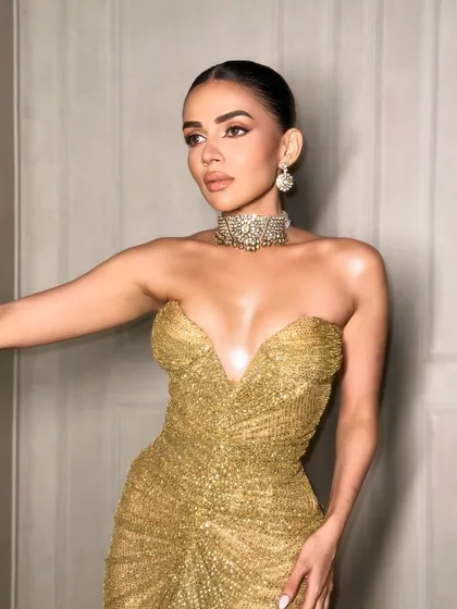 Another angle of this golden look. The makeup is all about that wet, glossy skin finish.