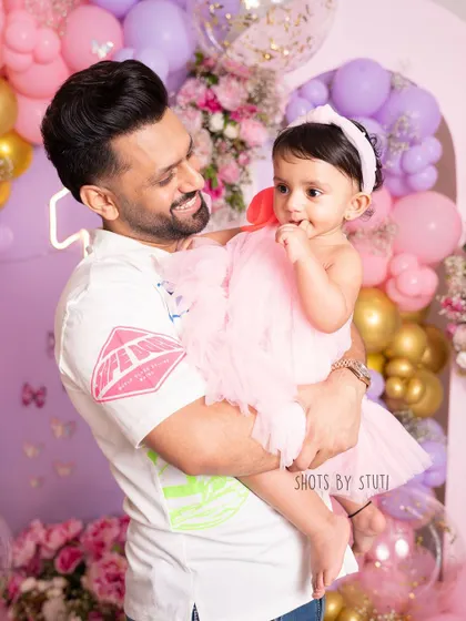 A beautiful father-daughter moment. Here's Rahul Vaidya sharing a sweet look with his daughter Navya during her first birthday photoshoot. These are the heartfelt connections I love to capture.